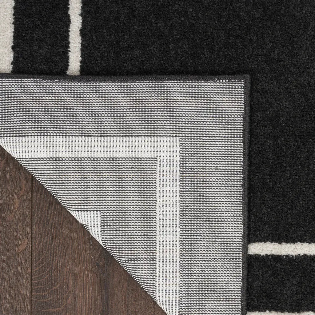 6' Black And Ivory Indoor Outdoor Runner Rug Homeroots Outdoor