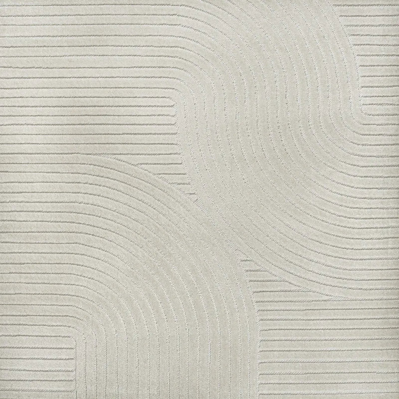 Beige textured fabric with embossed wavy lines, ideal for modern upholstery and home decor accents.