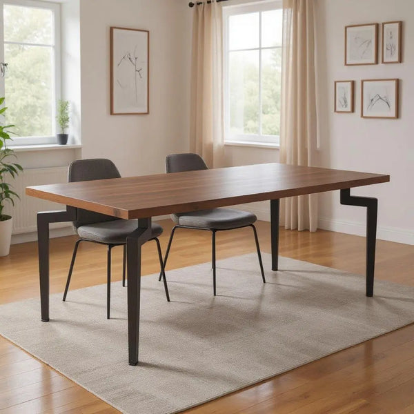 Modern wooden dining table with a walnut finish and sleek black metal legs, paired with gray upholstered chairs.