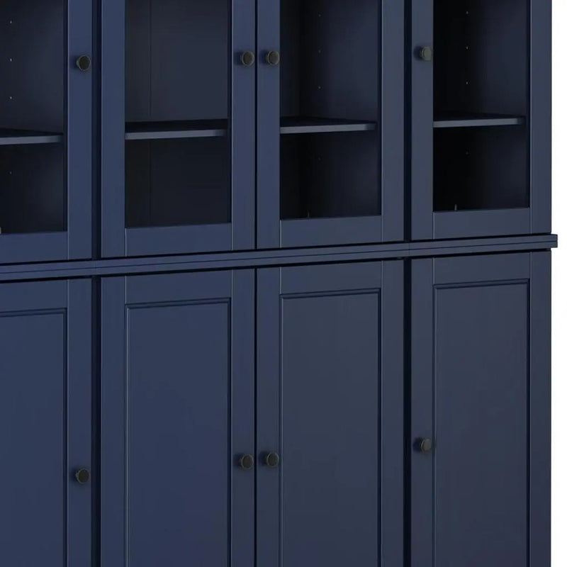 Navy blue wooden cabinet with glass doors, features sleek black knobs and multiple shelves for storage.