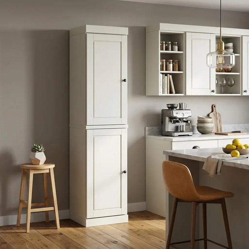 Modern cream kitchen cabinet with sleek design, paired with a wooden stool and stylish bar chair in a contemporary setting.