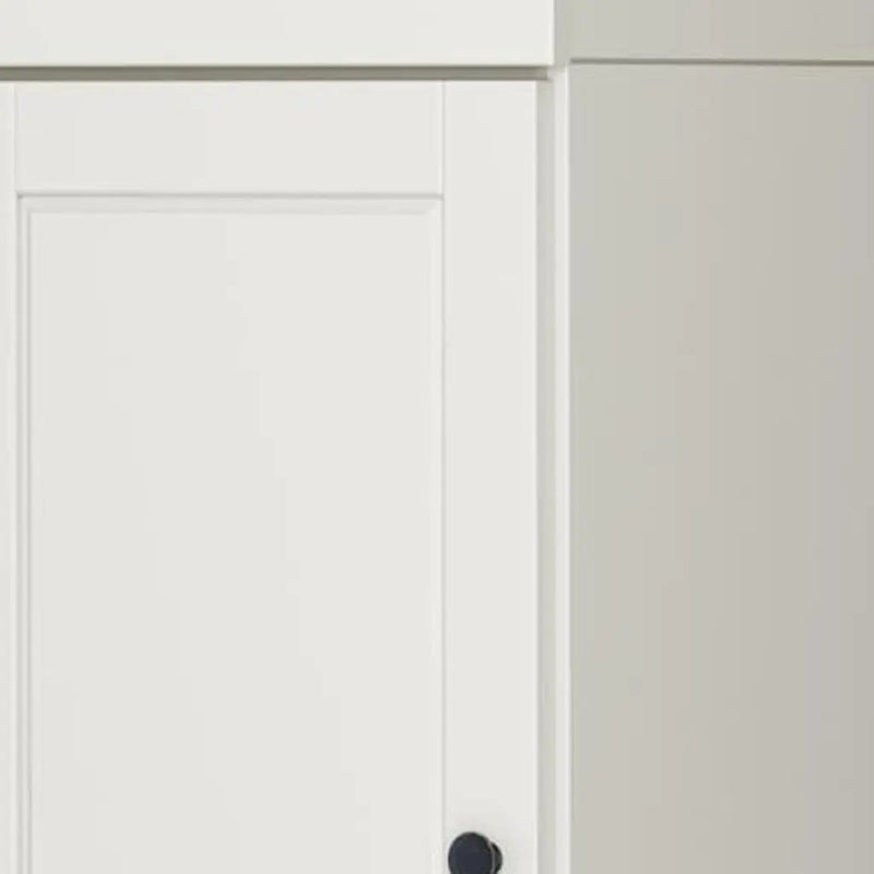 White cabinet door with a sleek black knob, featuring a modern, minimalist design and smooth finish.