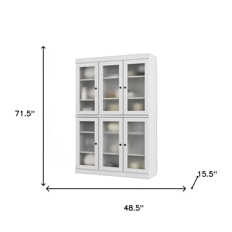 White wooden cabinet with glass doors, four compartments, modern style, dimensions 71.5" H x 48.5" W x 15.5" D.