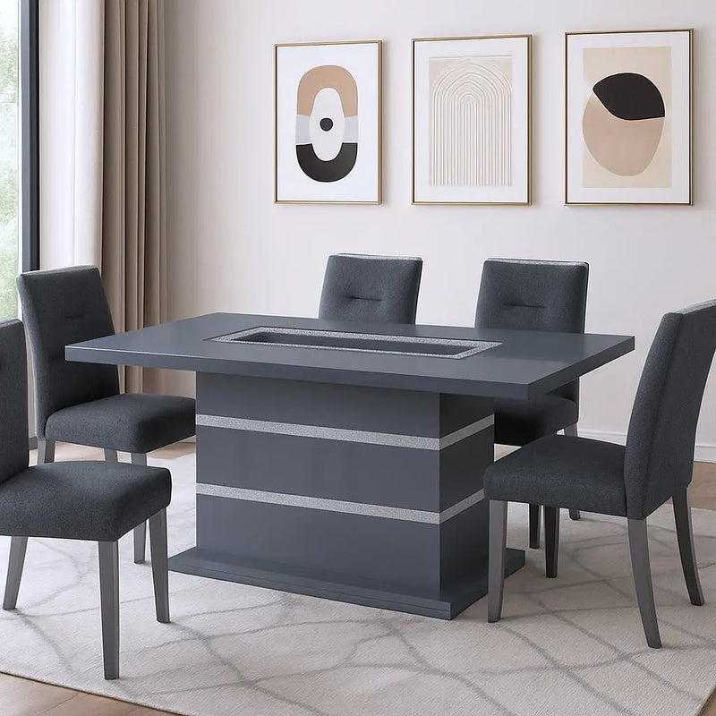 Modern gray rectangular dining table with a sleek design, featuring a glass insert and surrounded by upholstered gray chairs.