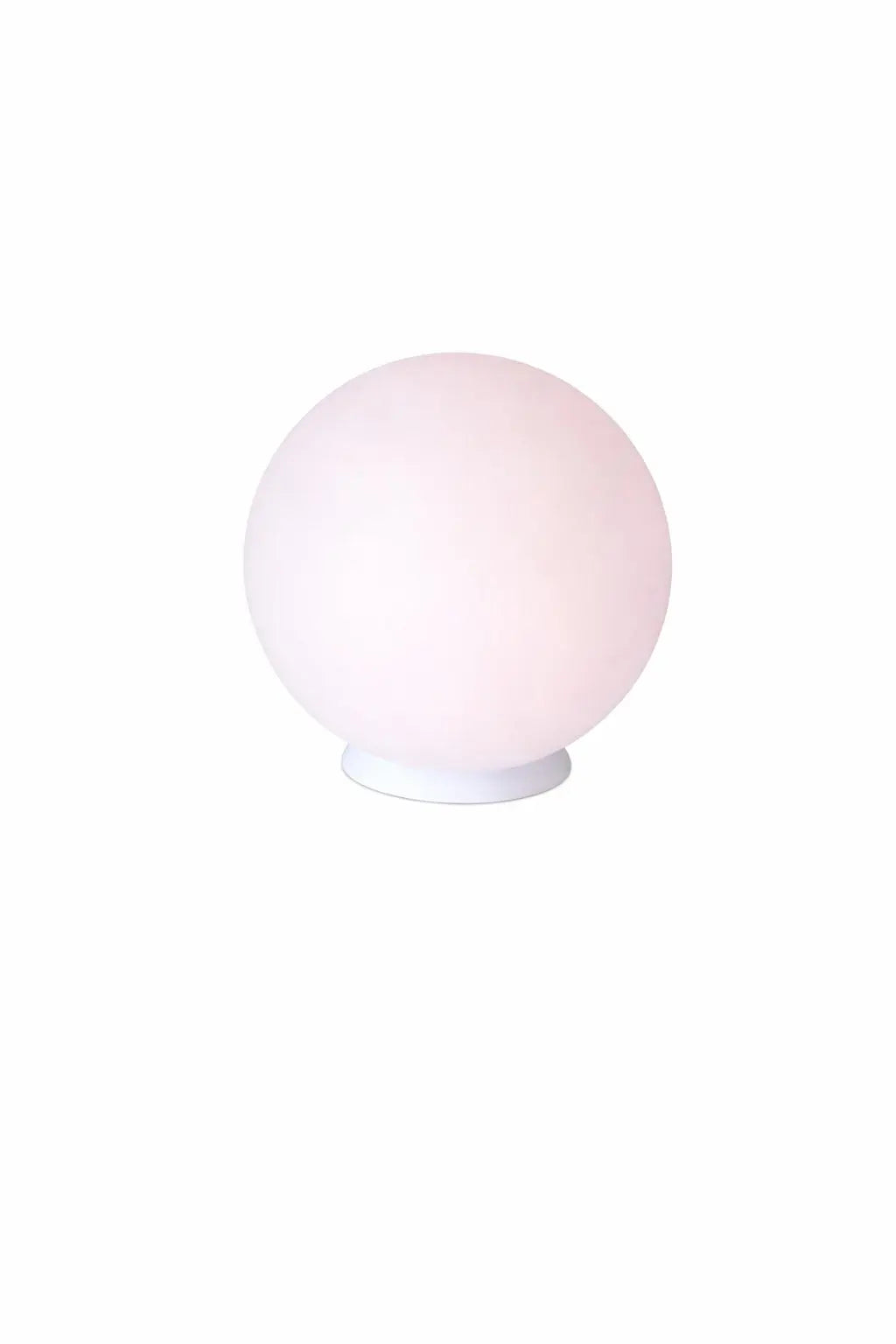 Round pink glass table lamp on a white base, perfect for modern and minimalist home decor.