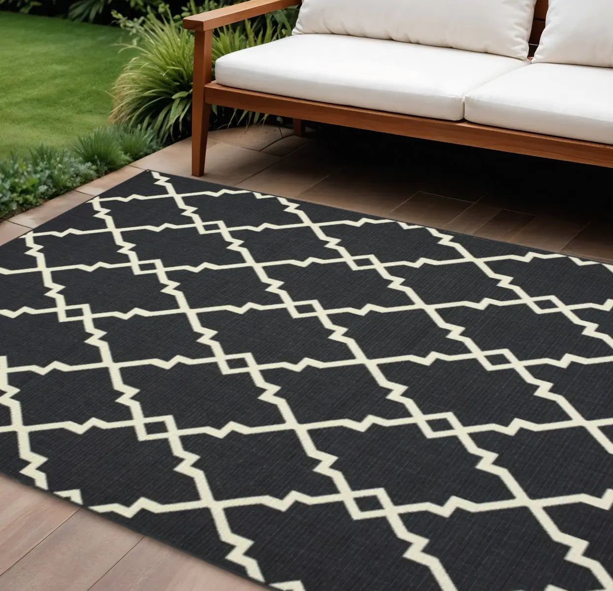 7' X 10' Black And Ivory Indoor Outdoor Area Rug Homeroots Outdoor