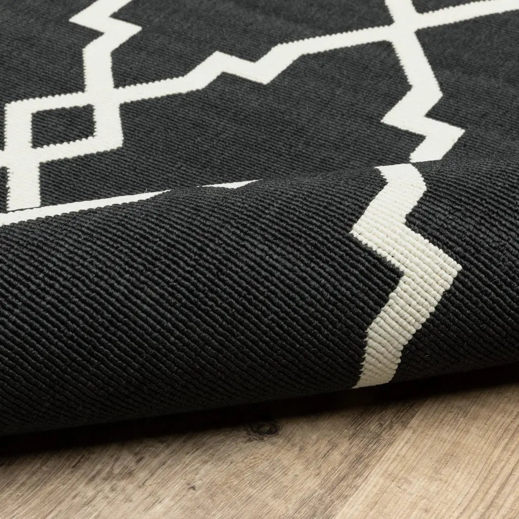 7' X 10' Black And Ivory Indoor Outdoor Area Rug Homeroots Outdoor