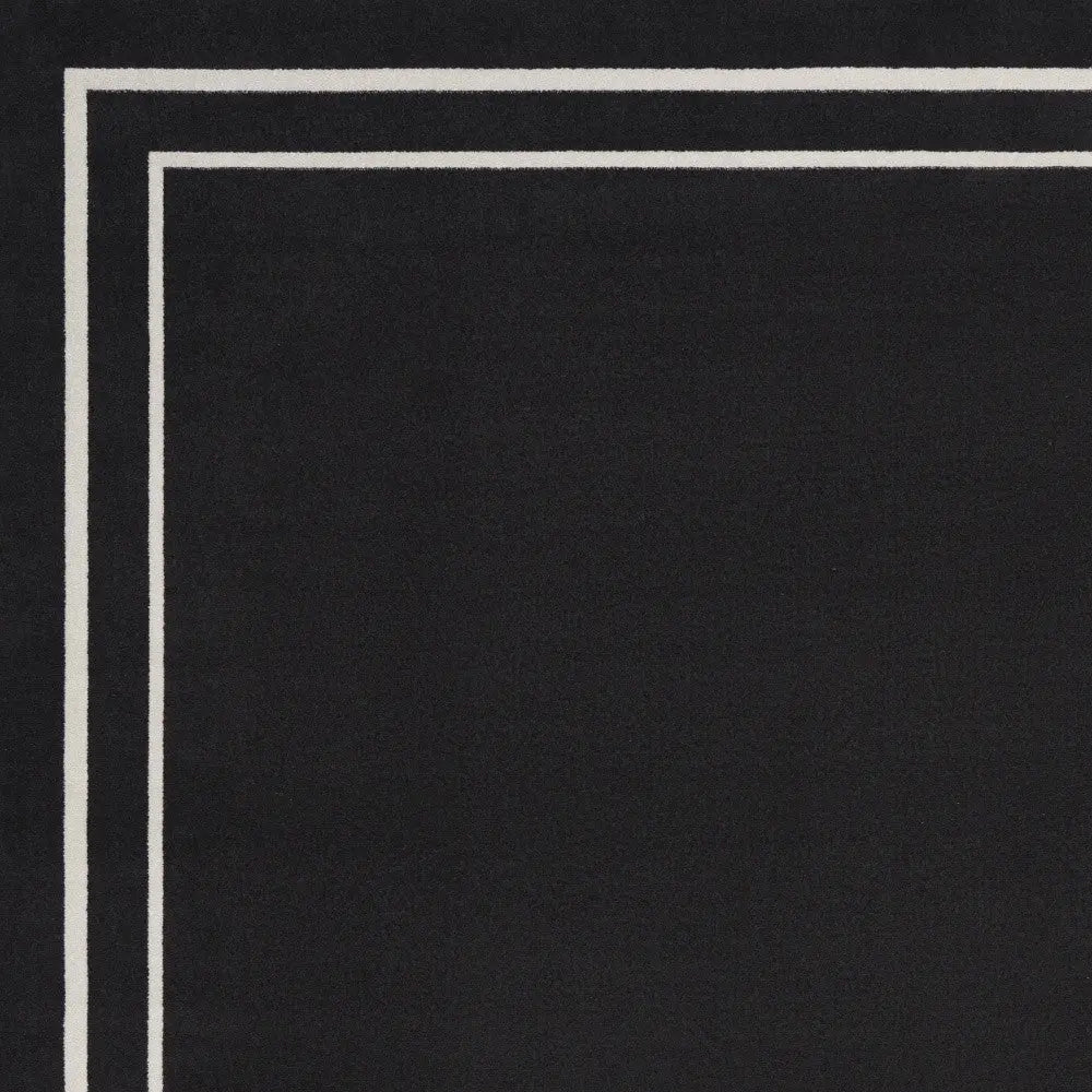 7' X 10' Black And Ivory Indoor Outdoor Area Rug Homeroots Outdoor