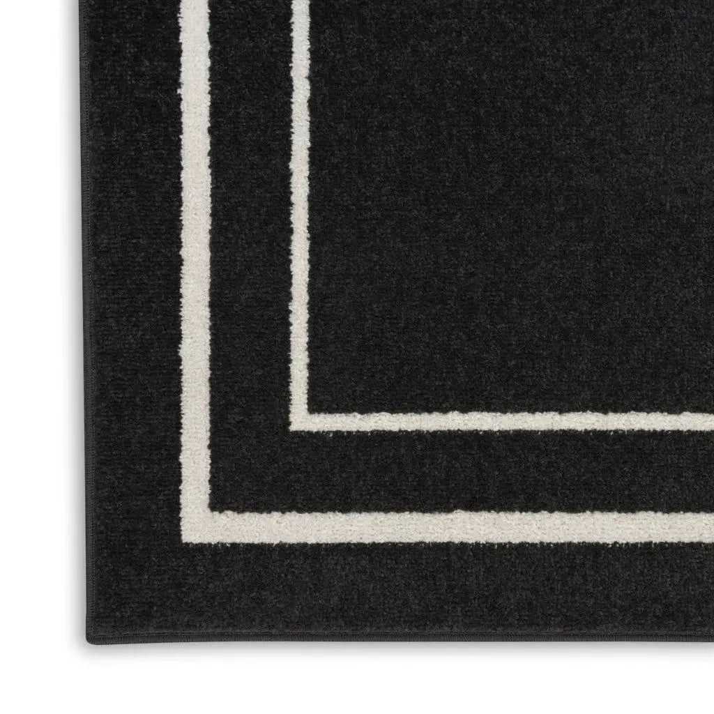 7' X 10' Black And Ivory Indoor Outdoor Area Rug Homeroots Outdoor