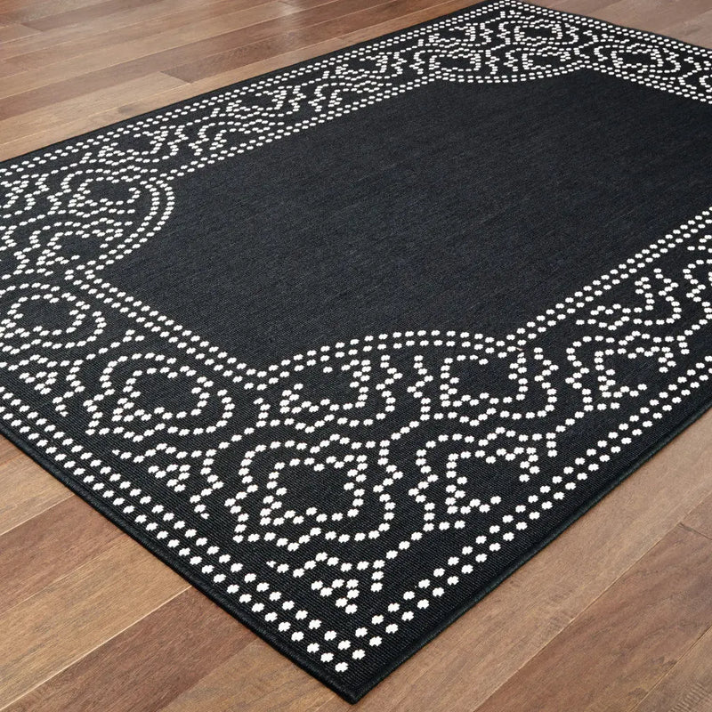 7' X 10' Black and Ivory Stain Resistant Indoor Outdoor Area Rug Homeroots Outdoor