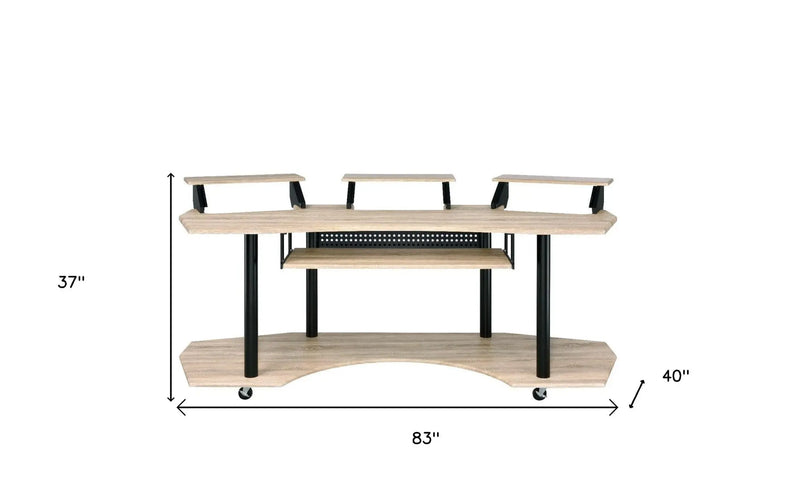 Modern wooden media console in light oak finish, featuring three open shelves and black metal legs, measuring 83" x 40".