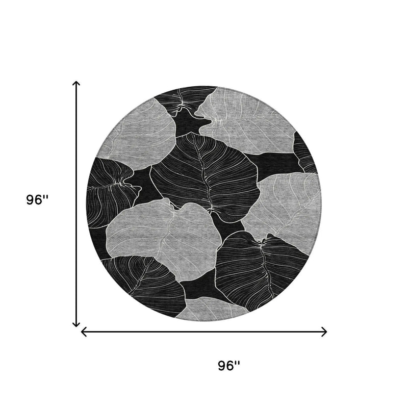 Black and white round rug with leaf patterns, 96 inches in diameter, perfect for modern living spaces.