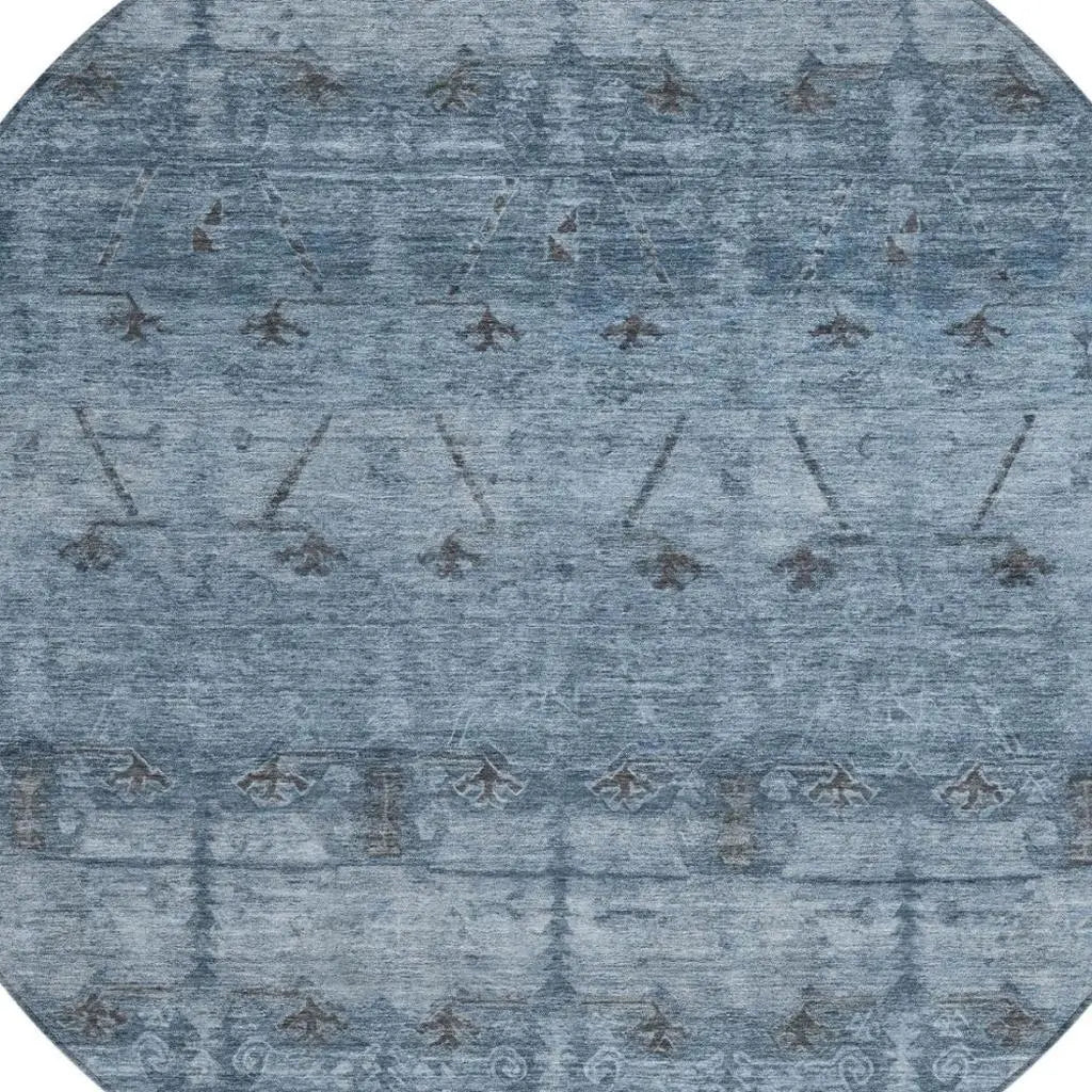 Round blue area rug with intricate patterns, made of soft wool, perfect for modern and stylish home decor.