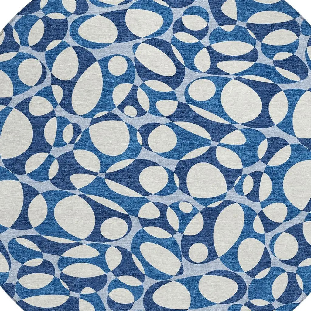 Blue and cream abstract pattern round rug made of durable woven fabric, ideal for modern home decor.