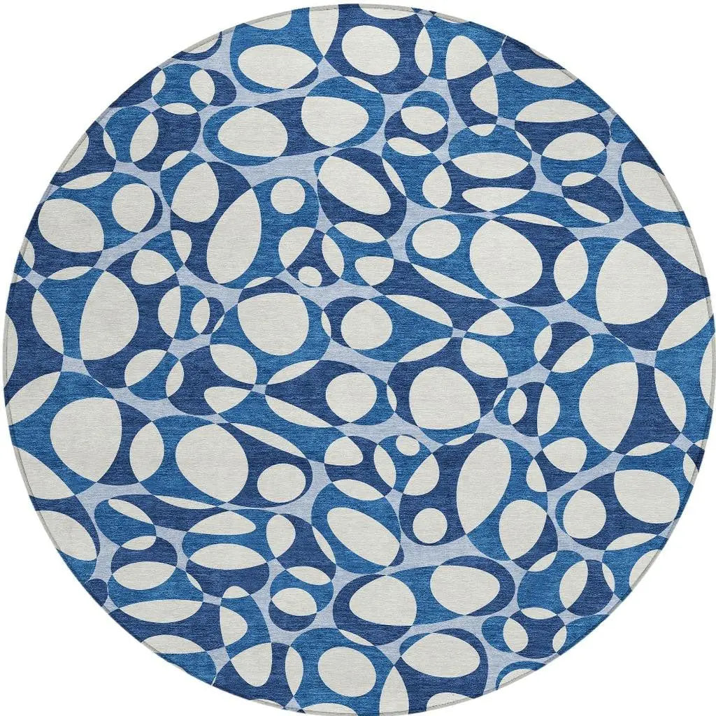 Blue and white abstract circular rug, featuring a modern design and textured fabric, perfect for contemporary decor.
