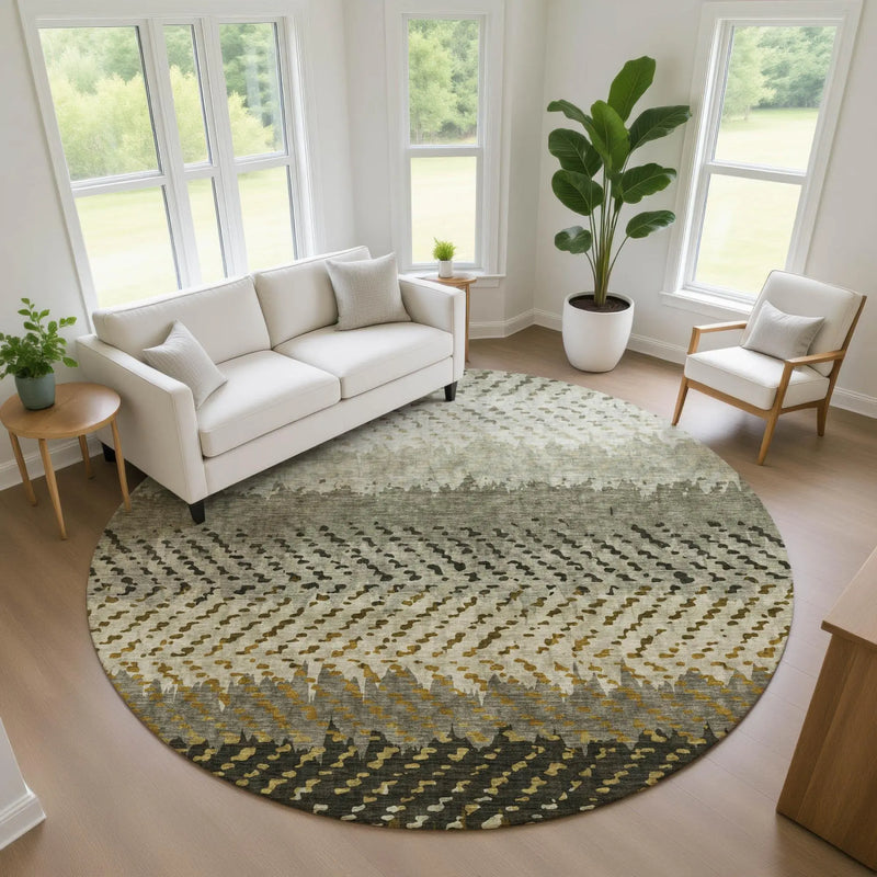Round area rug in grey, cream, and olive, showcasing a modern geometric pattern, perfect for contemporary living spaces.