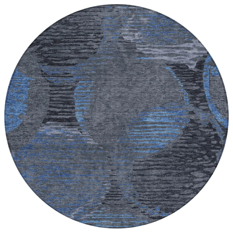 Round blue and gray abstract area rug, made of soft synthetic material, featuring a modern circular pattern.