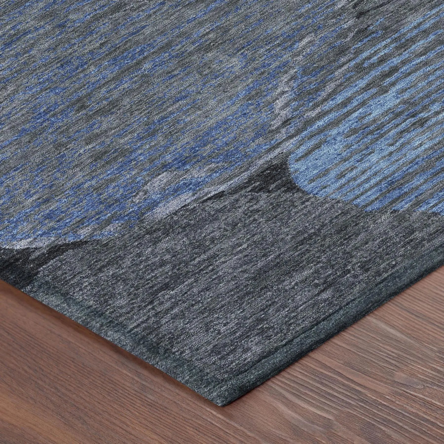 Gray and blue abstract area rug, crafted from soft, durable fibers, ideal for modern home decor.
