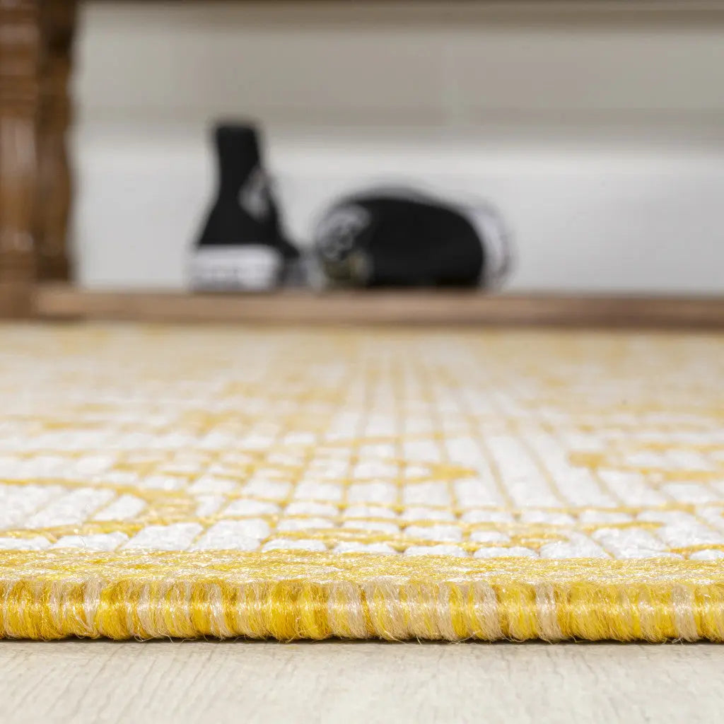 Yellow geometric woven area rug with a textured finish, perfect for modern or contemporary home decor.