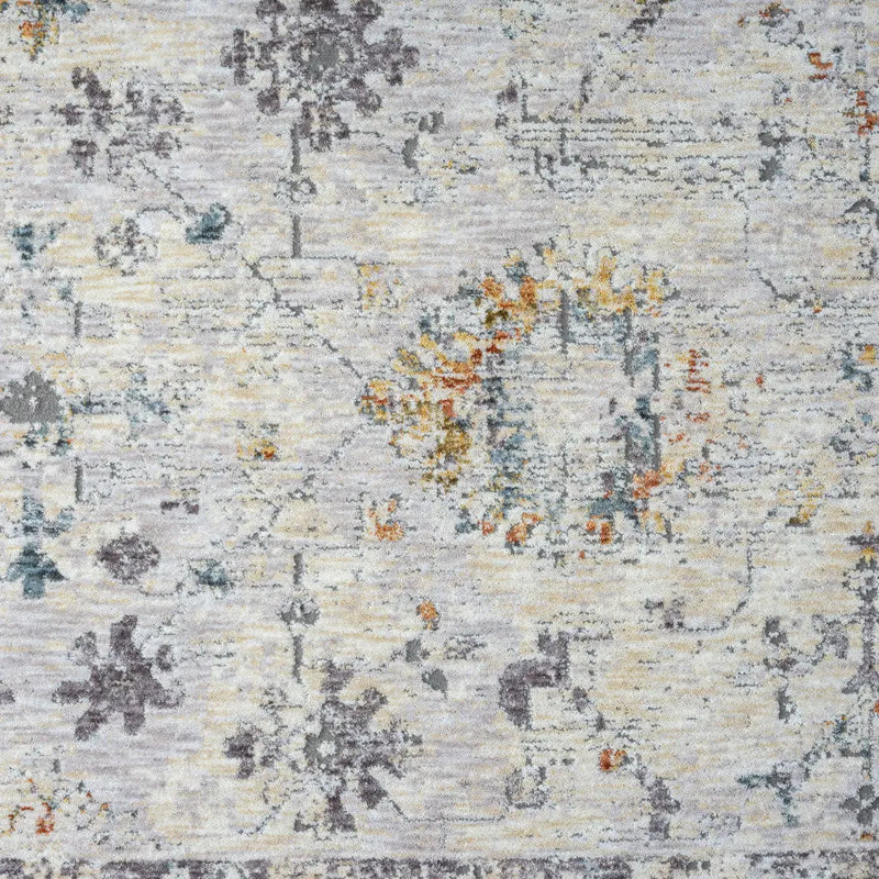 Vintage-style area rug in muted gray, cream, and soft yellow, featuring elegant floral patterns in a distressed finish.