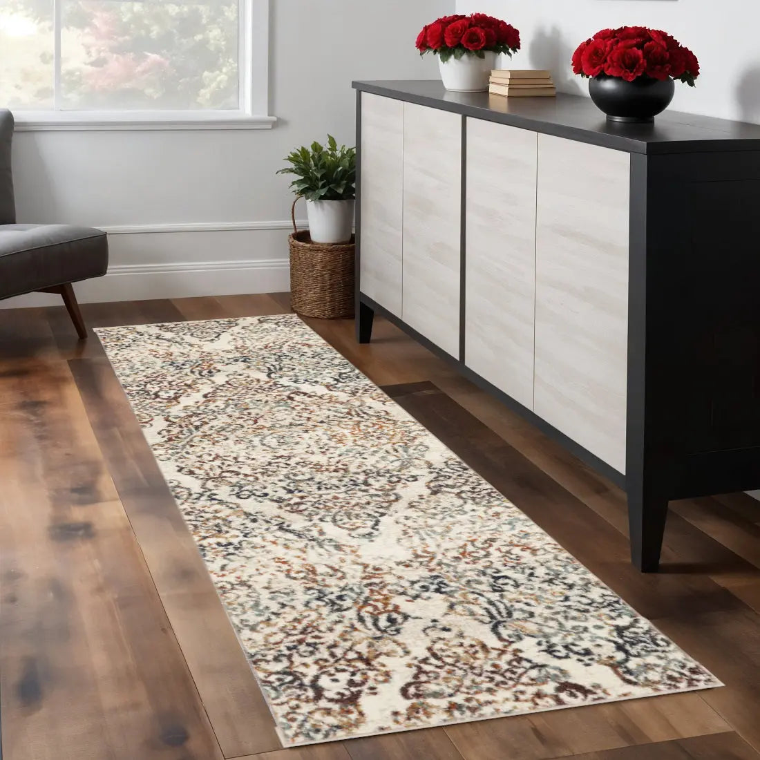 Beige and blue patterned runner rug in a modern living room setting with a wooden floor and minimalist furniture.