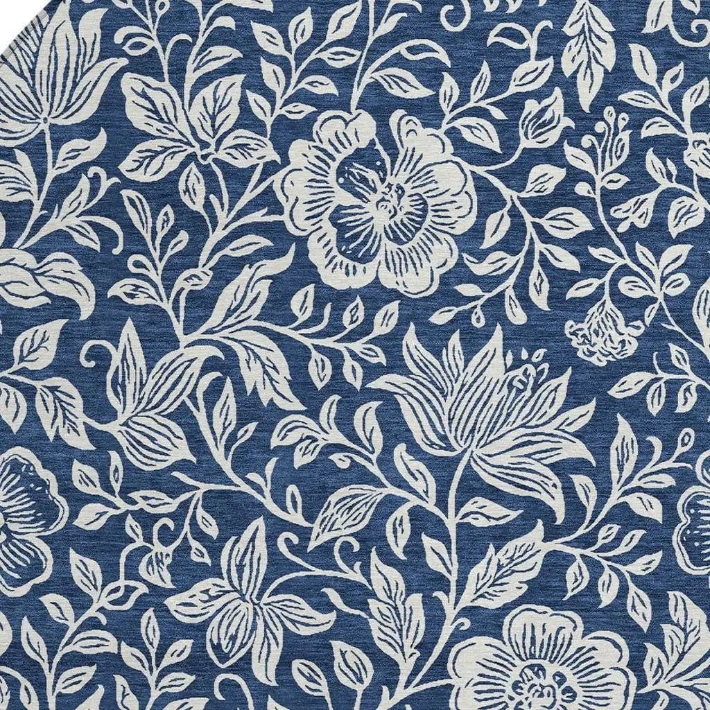 Navy blue floral cotton fabric with white botanical prints, perfect for upholstery and home decor projects.