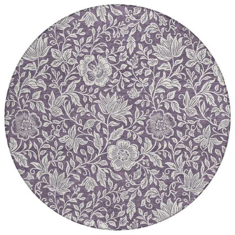 Round purple floral area rug, featuring white botanical prints on soft, durable fabric. Perfect for modern decor.