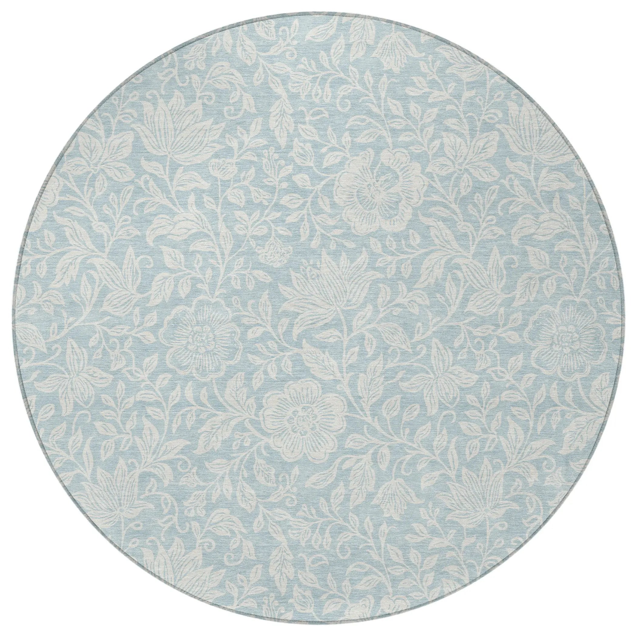 Light blue round rug with floral pattern, made from durable, soft material, perfect for adding a stylish touch to any room.