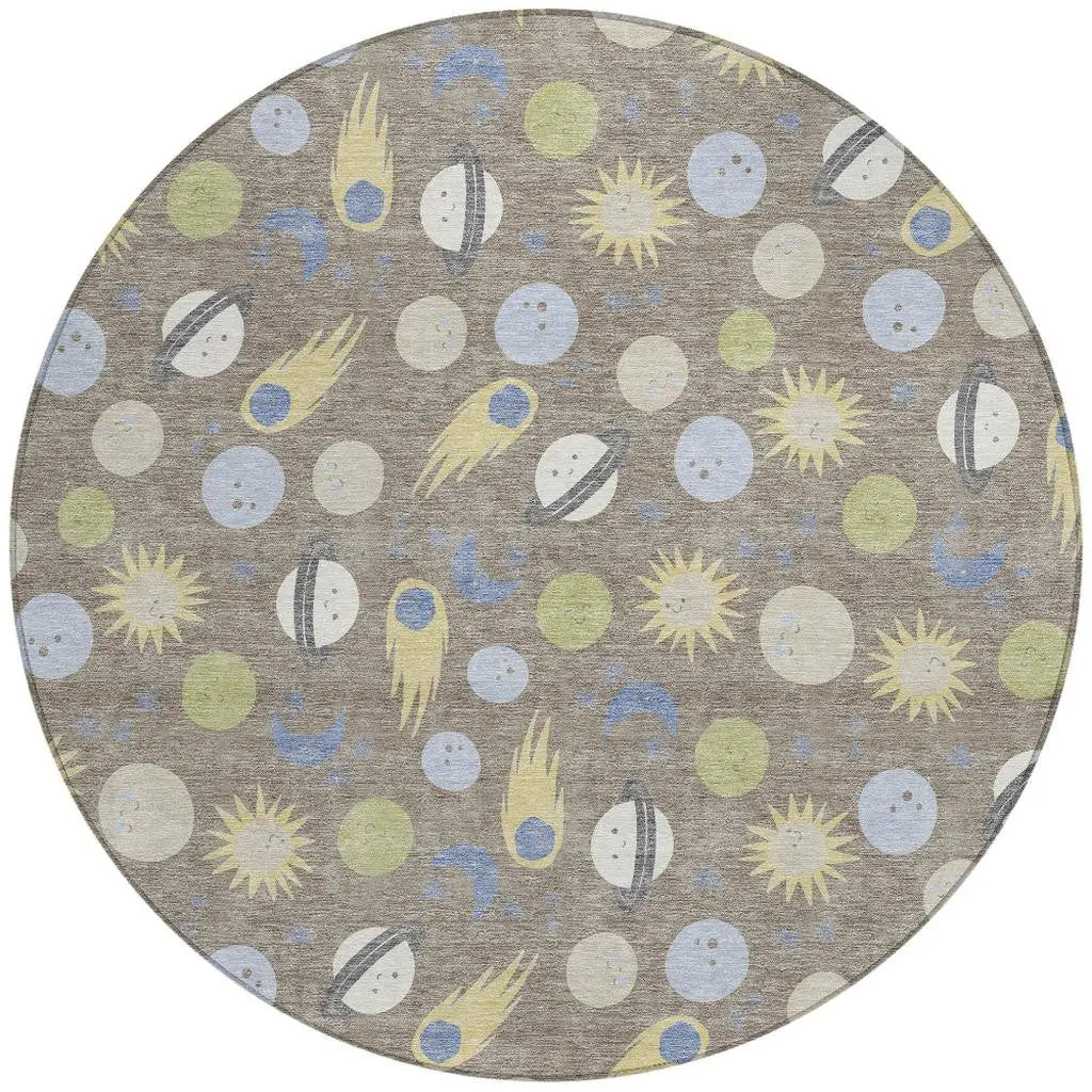Round area rug featuring a playful space theme with planets, stars, and comets in soft pastel colors on a gray background.