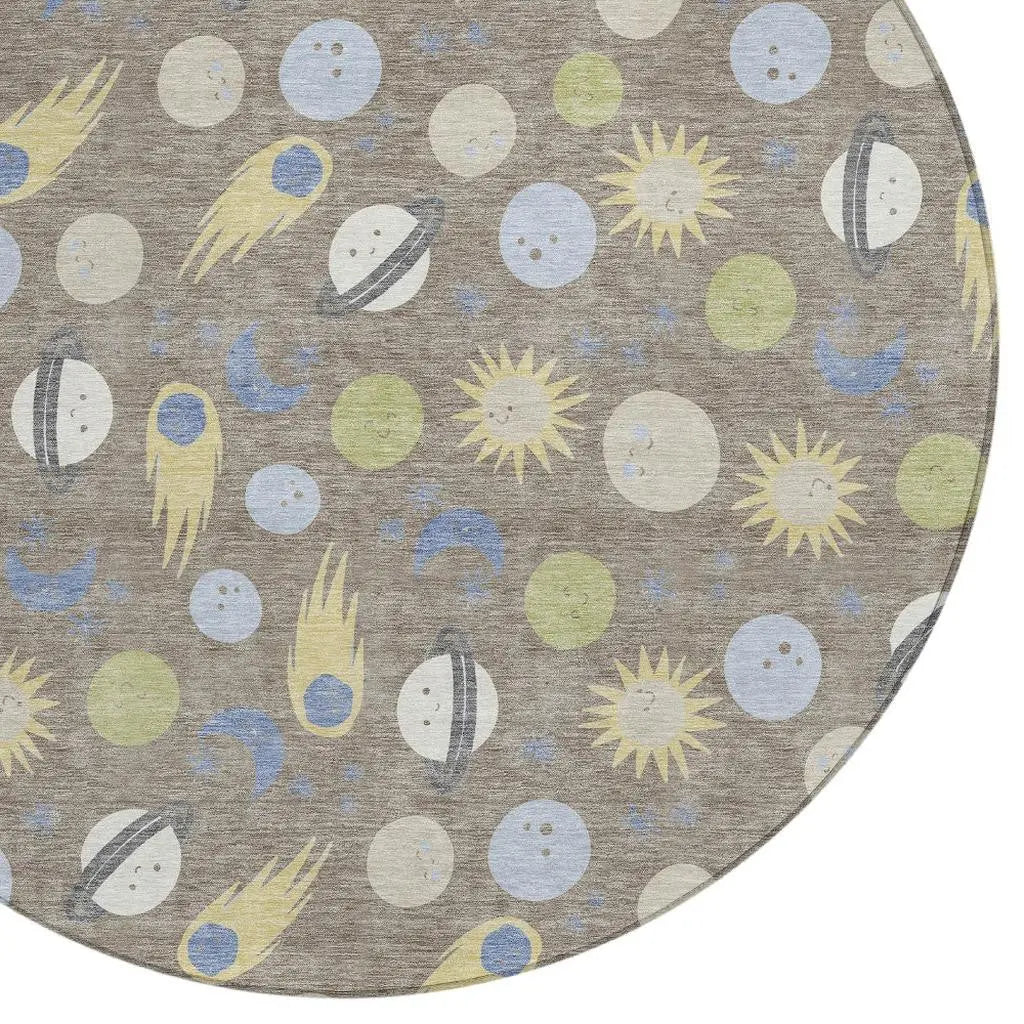 Round rug featuring a cosmic design with planets, stars, and comets in soft pastel colors on a gray background.