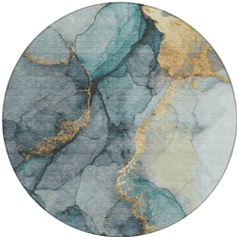 Round area rug featuring abstract teal, gold, and gray marble design in soft, plush material. Ideal for modern decor.