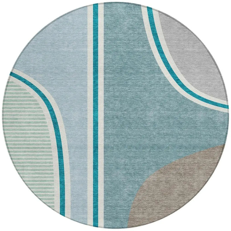 Round modern area rug in blue, gray, and green geometric patterns, made of soft, durable material. Eco-friendly design.