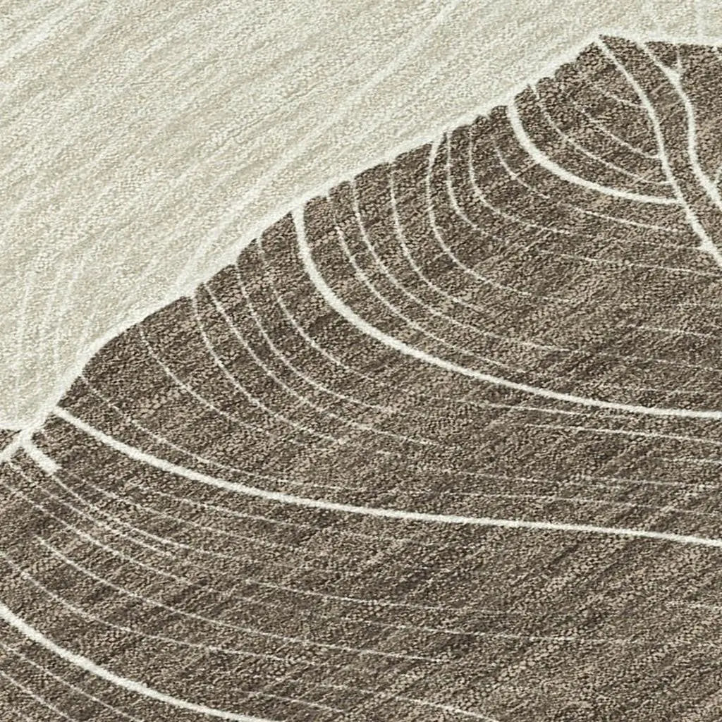 Beige and brown abstract area rug with textured leaf patterns, perfect for contemporary home decor.