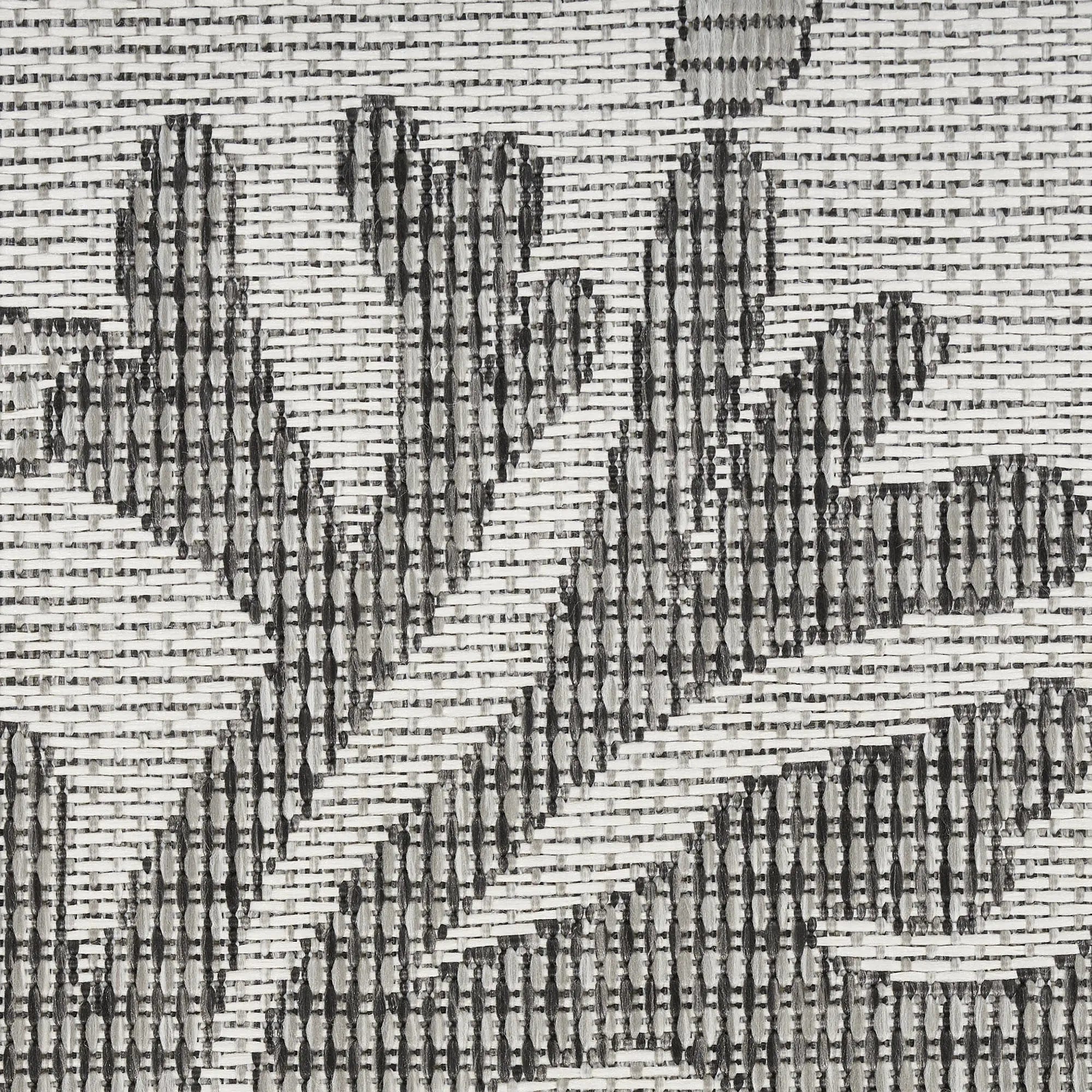 Black and white floral woven fabric with intricate patterns, ideal for upholstery or home decor projects.