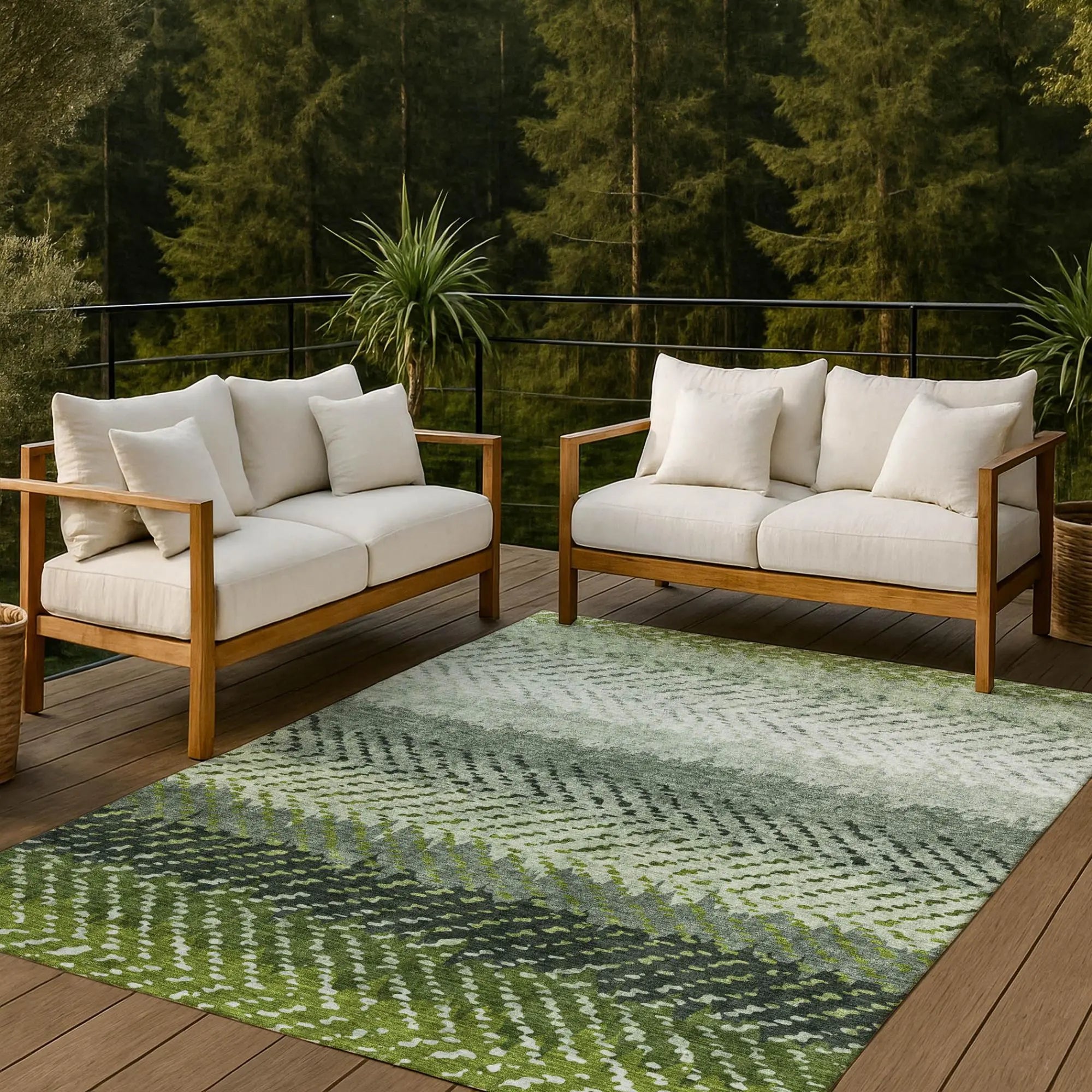 Light beige outdoor sofa with wood frame, complemented by a green patterned area rug, perfect for patio relaxation.