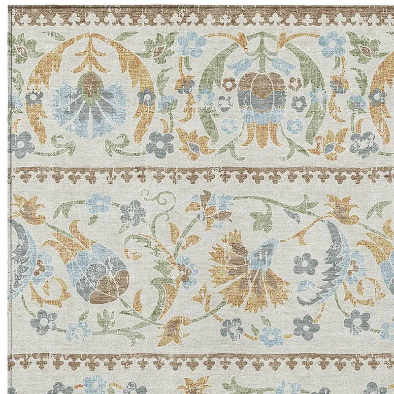 Vintage floral patterned fabric in soft pastels, featuring blue, green, and orange hues on a neutral background.