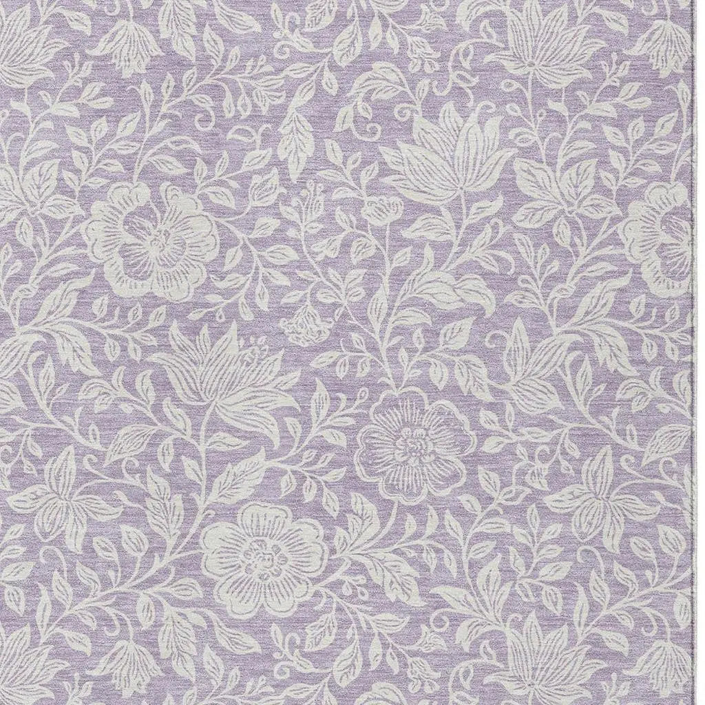 Lavender floral patterned fabric with white embroidery, perfect for home decor and upholstery projects.