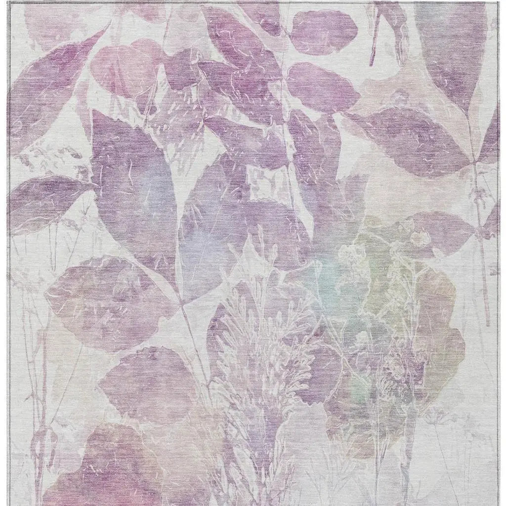 Light pastel floral area rug with purple and green hues, featuring a soft texture and modern botanical design.