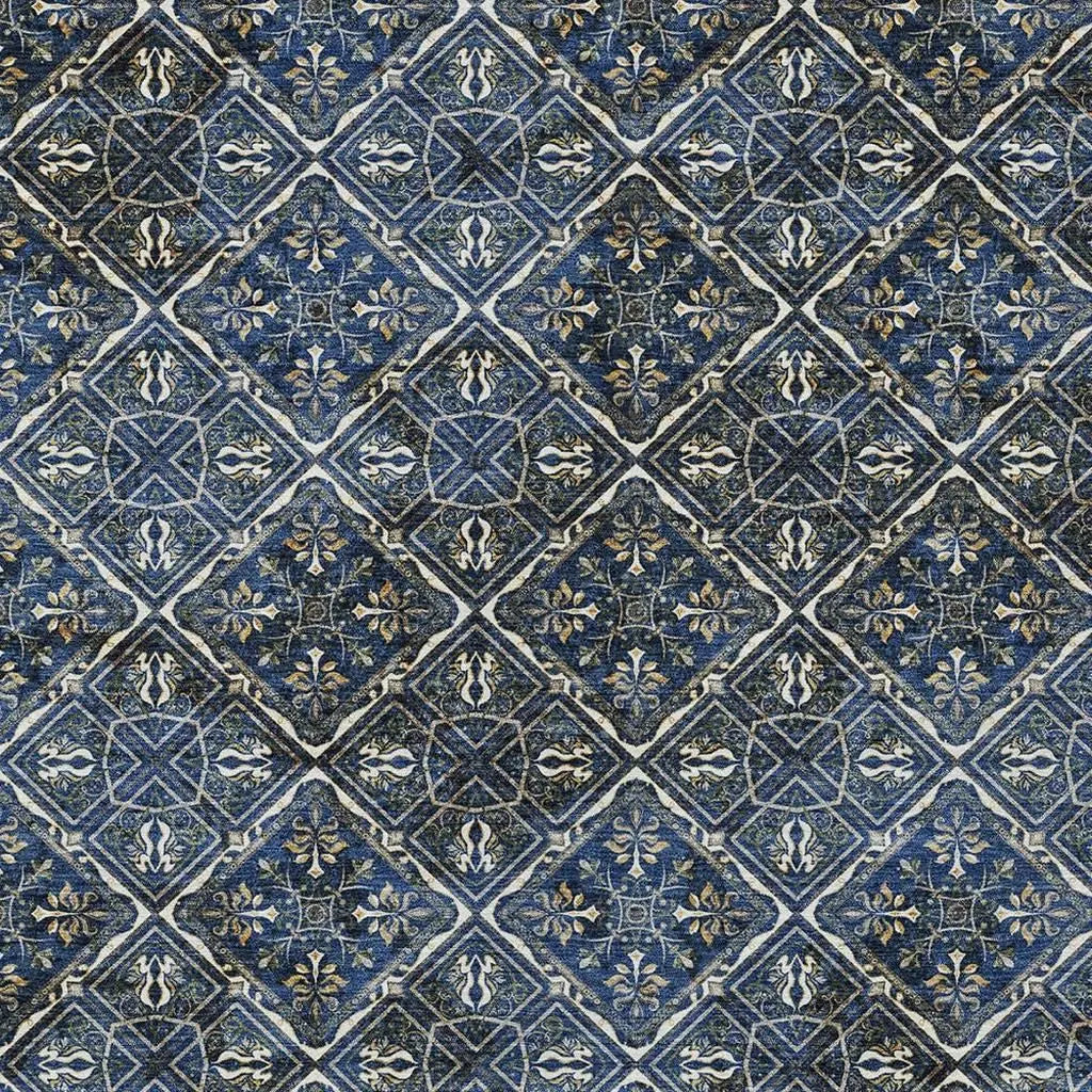 Navy blue patterned area rug with intricate floral and geometric designs, featuring shades of gold and cream.