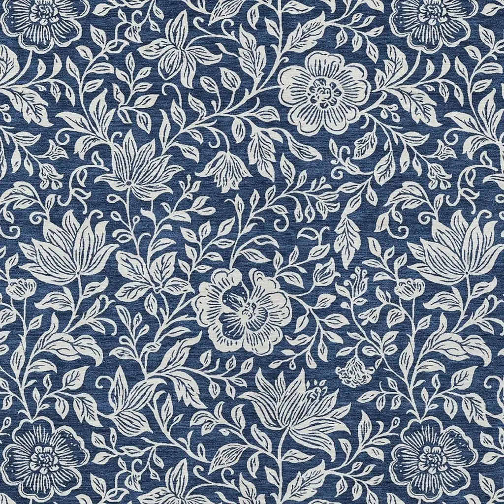 Navy floral print fabric with white botanical design, ideal for upholstery or sewing projects.