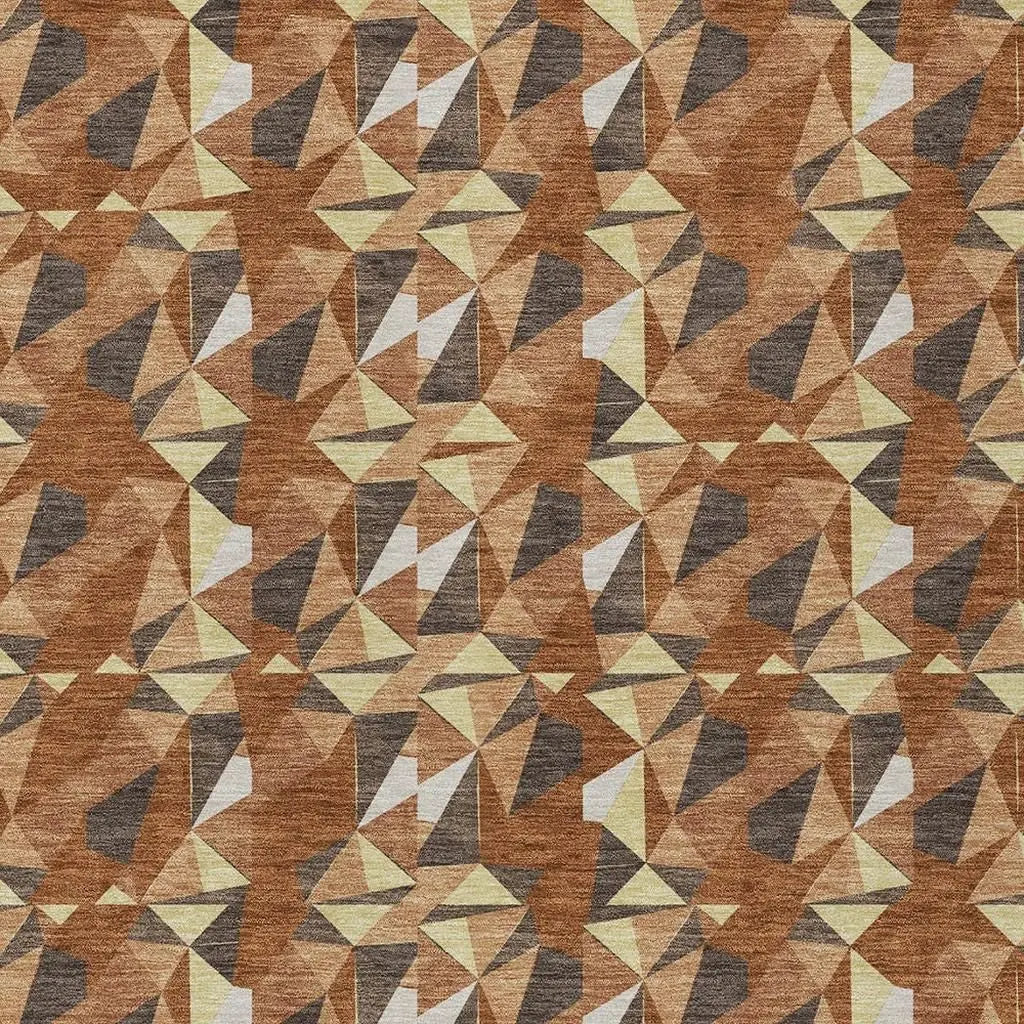 Geometric pattern fabric in warm browns, yellows, and grays, perfect for modern upholstery and home decor projects.