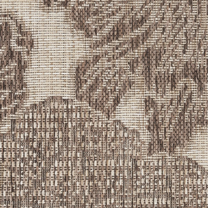 Textured brown and beige woven fabric with abstract geometric patterns, perfect for upholstery or decor projects.