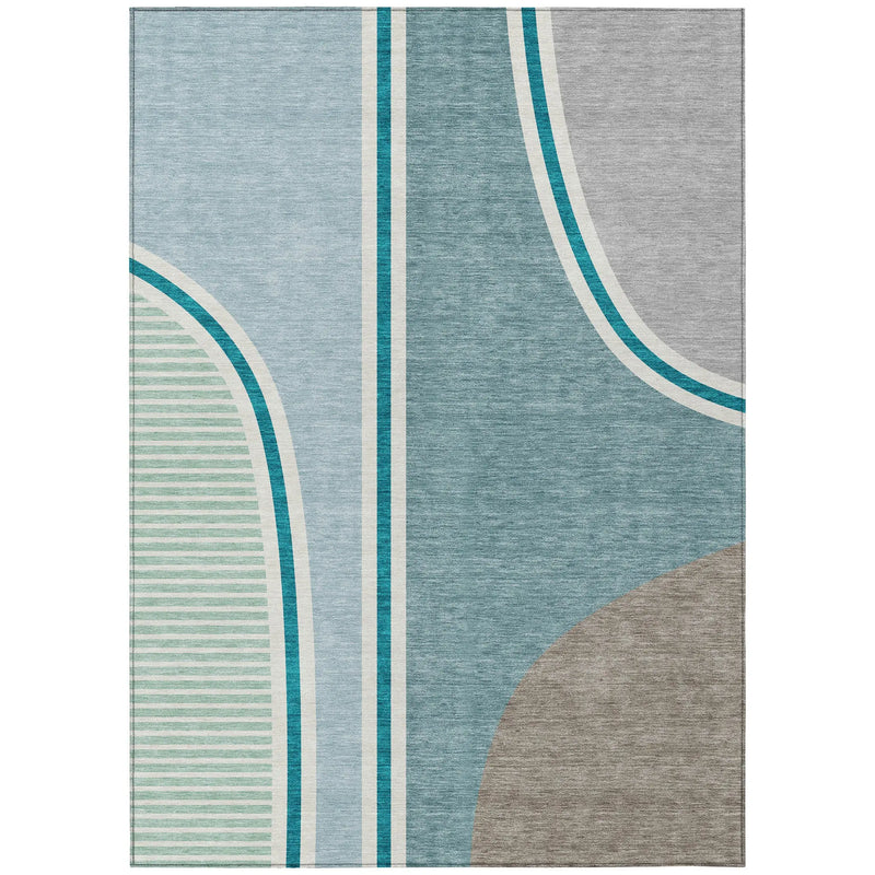 Modern abstract area rug with shades of blue, gray, and green, featuring geometric lines and soft, durable material.