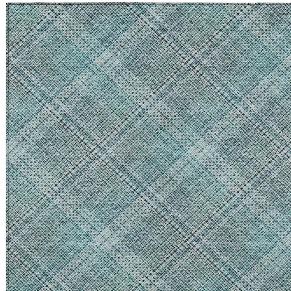Turquoise and gray plaid patterned fabric, lightweight, ideal for crafting or upholstery projects.