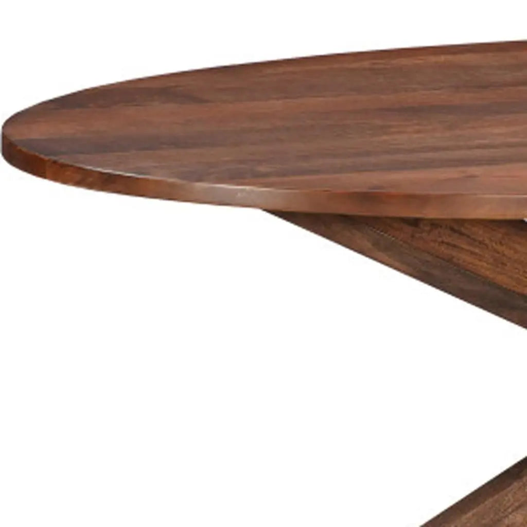 Oval brown wooden dining table with a modern design and sturdy base, perfect for elegant dining spaces.