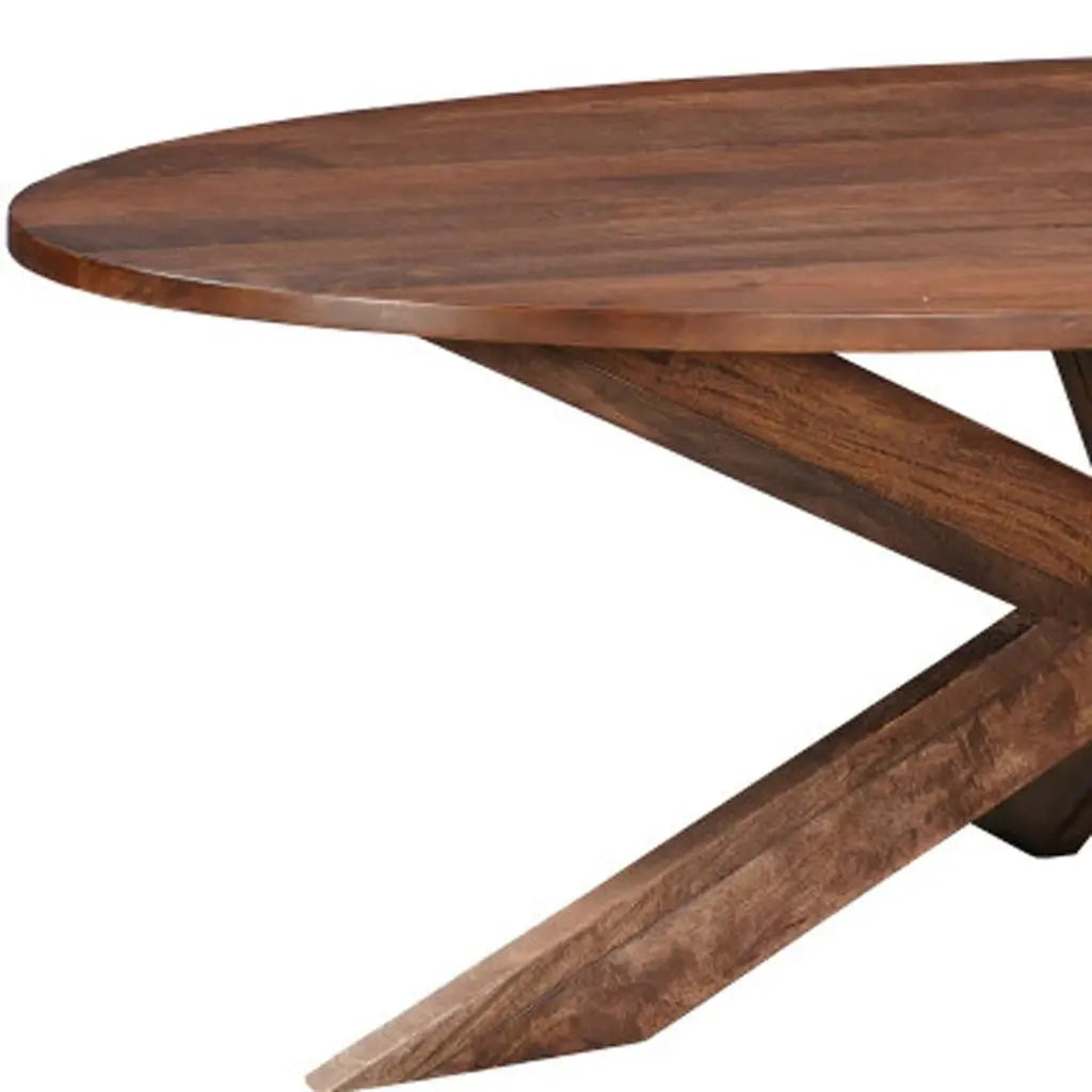 Oval walnut dining table with a modern geometric base, perfect for contemporary home decor.