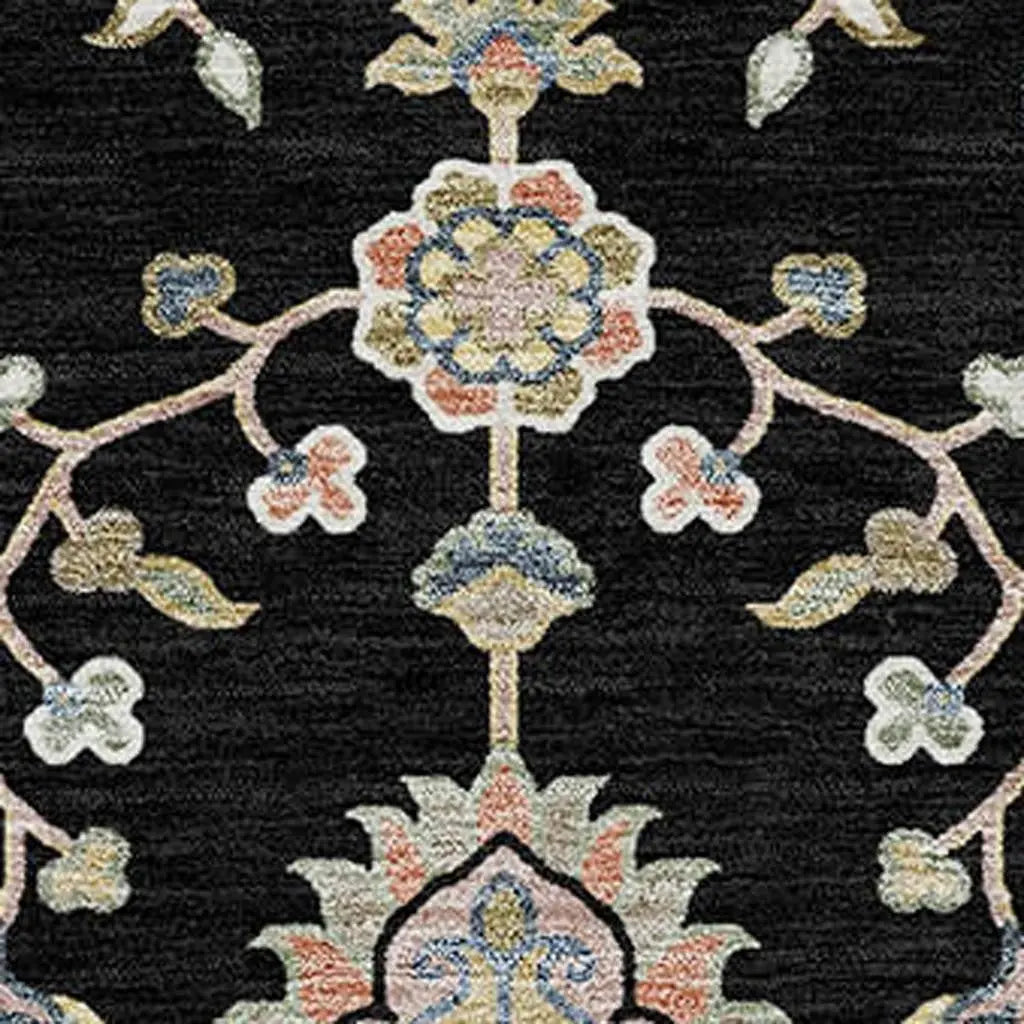 Black floral area rug with intricate multicolor patterns in blue, pink, and gold, adding elegance to any space.