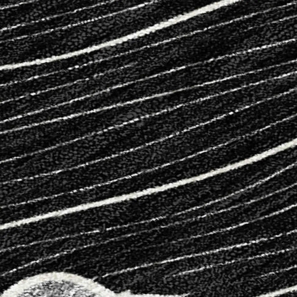 Black and white striped plush rug with a soft texture, ideal for modern home decor.