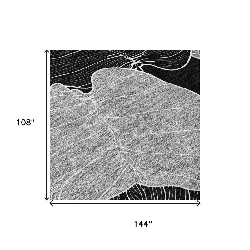 Black and white large area rug featuring abstract leaf design, 108" x 144", soft fabric, modern style.