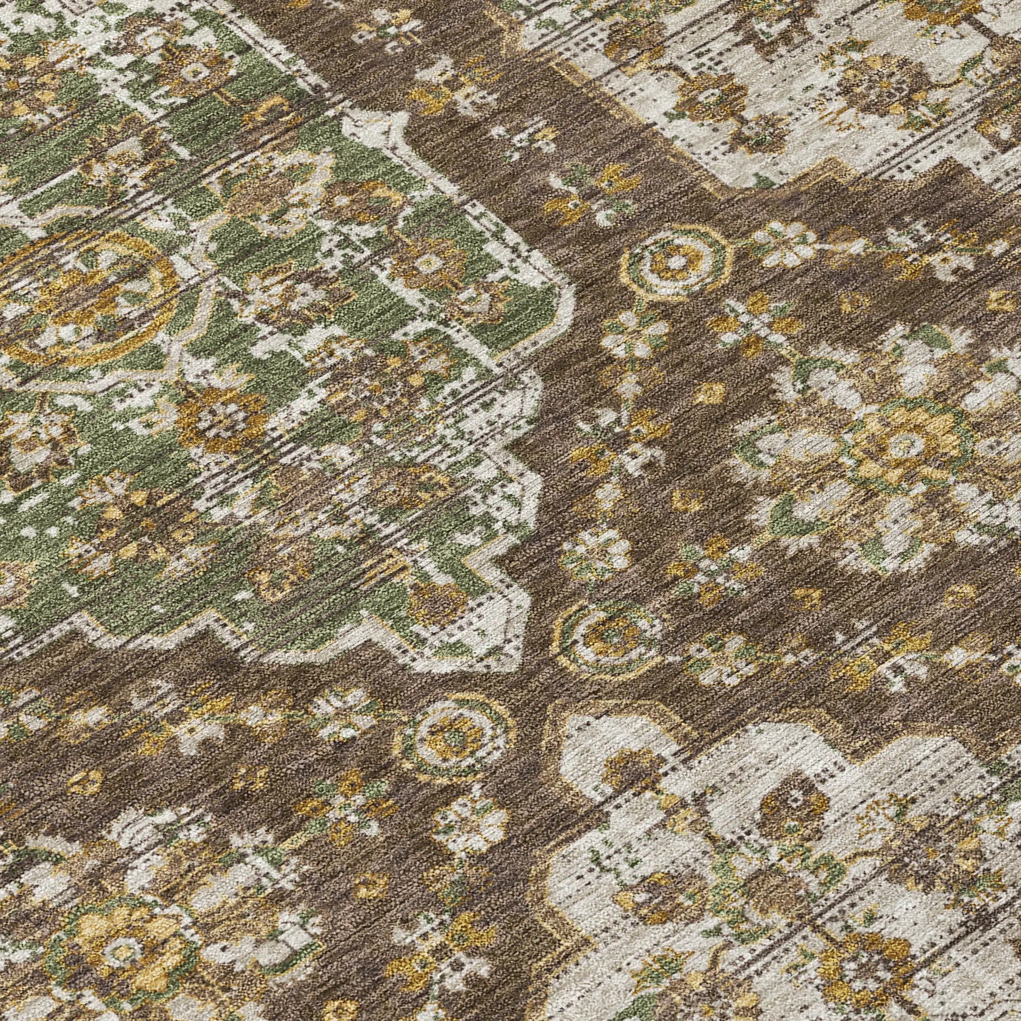 Vintage-style area rug in earthy tones of brown, green, and cream with intricate floral patterns.